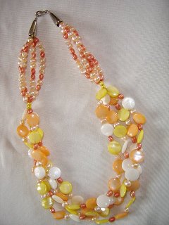 Multi-strand necklace of peach freshwater pearls and shell coin beads by Nico Beads 